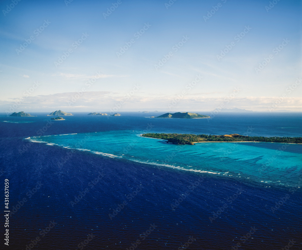 Aerial of a group of small pacific islands Aerial of a group of small pacific islands