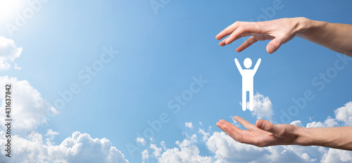 Hand on sky background holds human icon