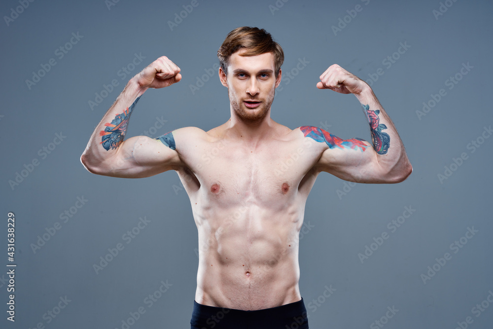 tattooed man naked torso bodybuilder Fitness portrait close-up