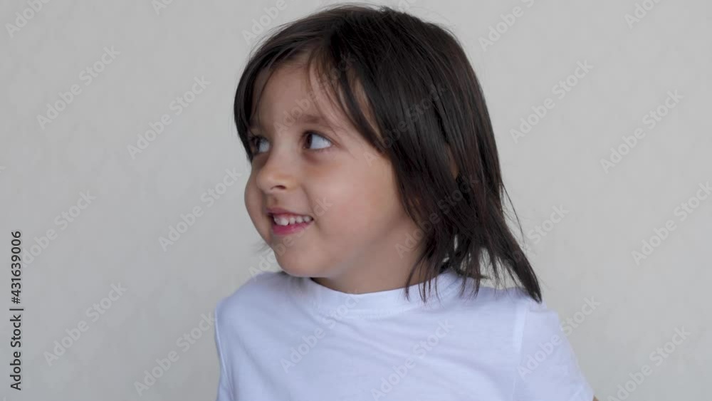 portrait of a boy a child looks at a portrait in white clothes portrait of a boy a child looks at a portrait in white clothes