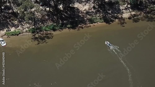 Outdoor nature drone aerial pan up muddy water river photo