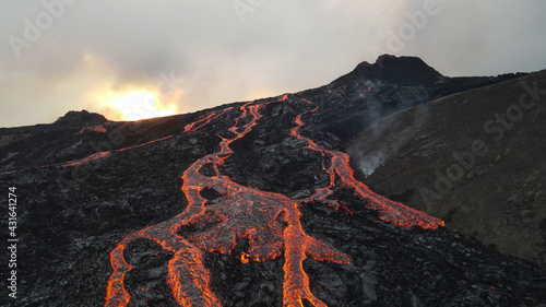 lava eruption volcano with snowy mountains, Aerial view Hot lava and magma coming out of the crater, April 2021 