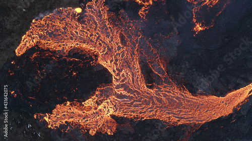 lava eruption volcano with snowy mountains, Aerial view
Hot lava and magma coming out of the crater, April 2021 
 photo