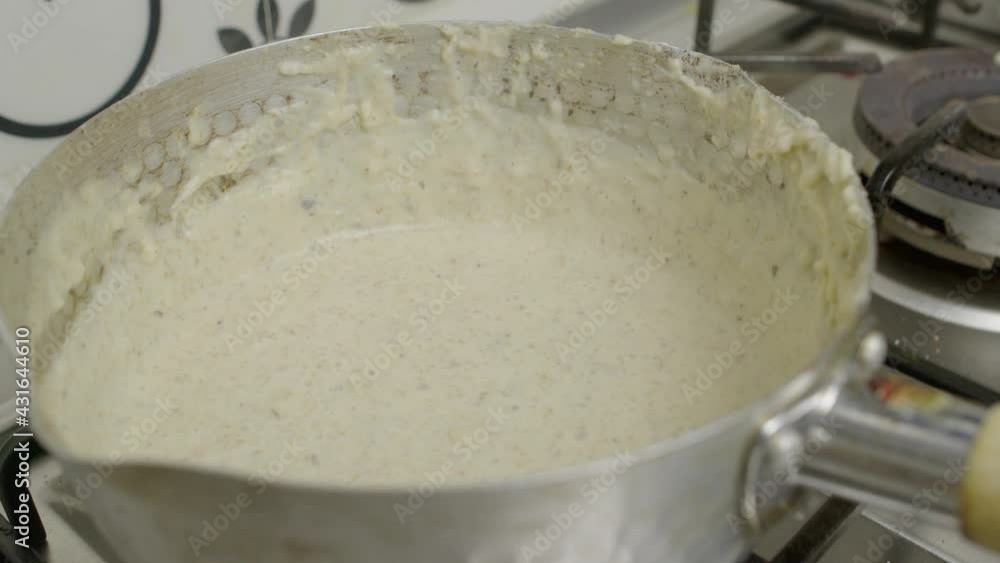 Mushroom sauce blended inside metal pot. Slow motion shot. Mushroom sauce blended inside metal pot. Slow motion shot.