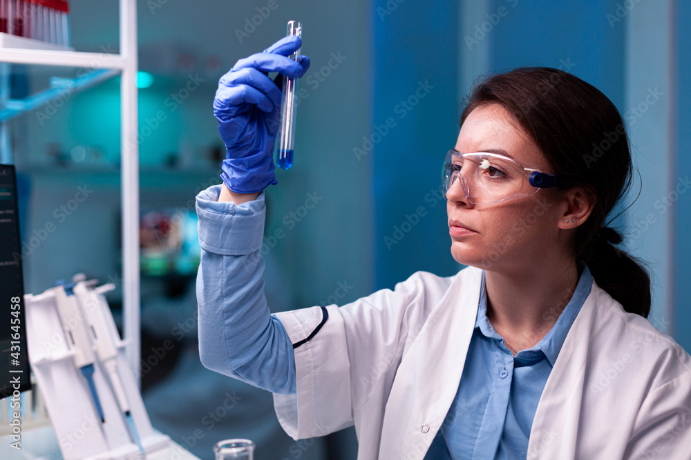 © DC Studio - Scientist looking at testube with sample, analyzing liquid experiment. Pharmaceutical biotechnologist in research laboratory works with test tube to find vaccine glove. © DC Studio - Scientist looking at testube with sample, analyzing liquid experiment. Pharmaceutical biotechnologist in research laboratory works with test tube to find vaccine glove.
