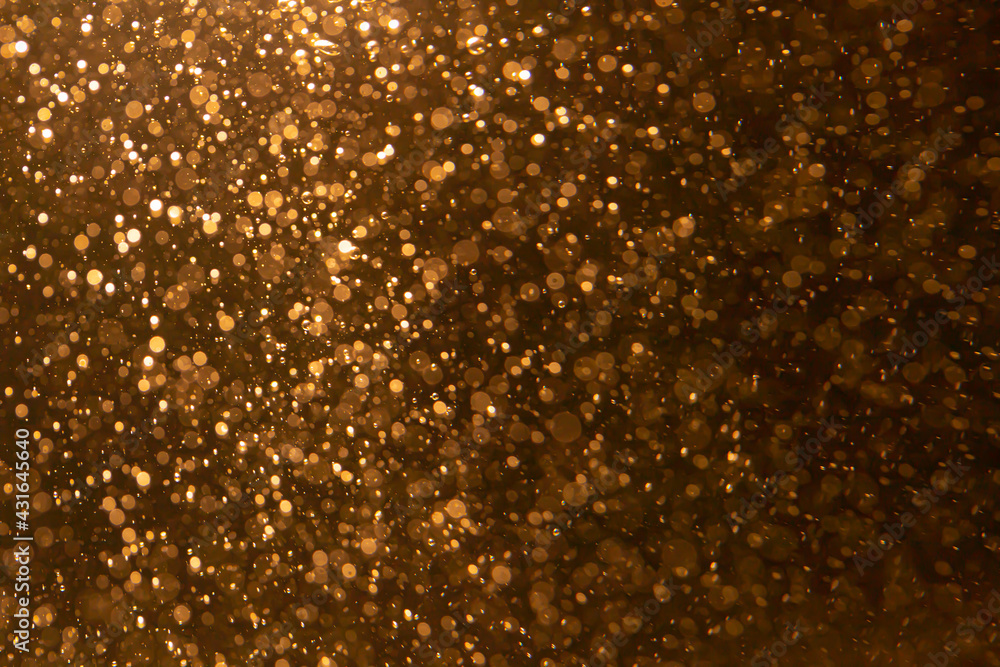 Gold bokeh blur defocus  with black background
