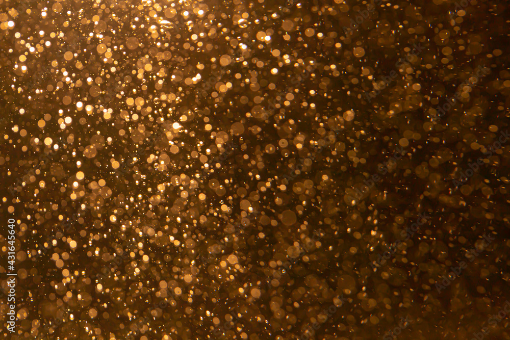 Gold bokeh blur defocus with black background Gold bokeh blur defocus with black background