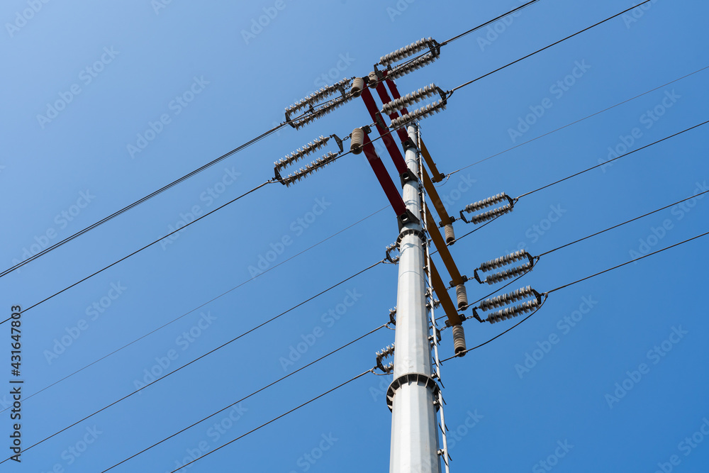 Telegraph pole with cables against a cloudy sky Telegraph pole with cables against a cloudy sky