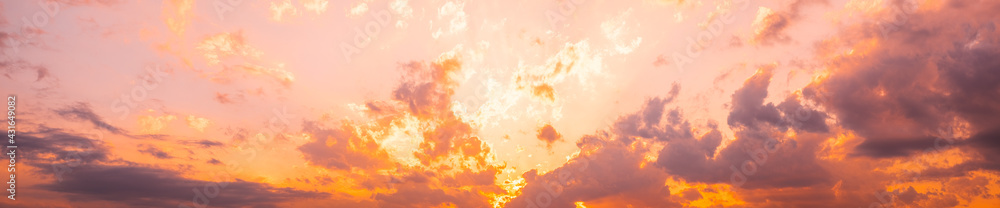 Panorama of sky. Orange blue and violet color sunset sky background.