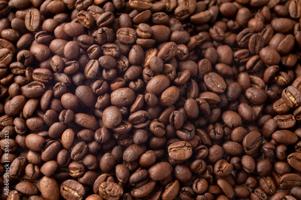 Fototapeta premium Texture of dark coffee beans. Coffee beans background. Roasted coffee full frame.