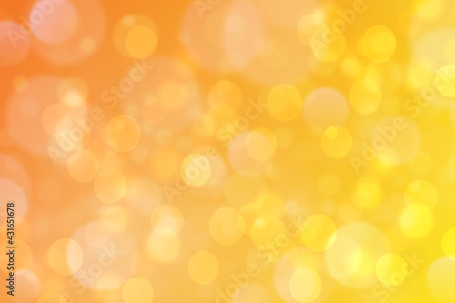 A festive abstract delicate golden yellow orange gradient background texture with glitter defocused sparkle bokeh circles. Card concept for Happy New Year, party invitation, valentine or other holiday