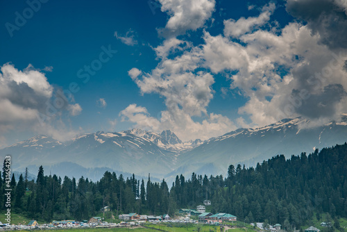 Gulmarg is a town, a hill station in summer time, a popular skiing destination of the Indian state of Jammu & Kashmir. It is a popular tourist destination and hill station photo