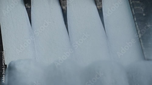 Closeup of Floodgate with flowing water through gate. Open the springway Khun Dan Prakan Chon Dam thailand photo