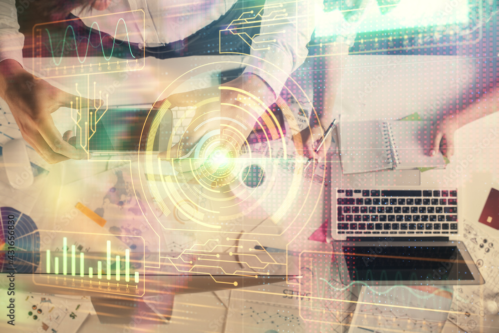 Obraz premium Double exposure of man and woman working together and data theme hologram drawing. Computer background. Top View.