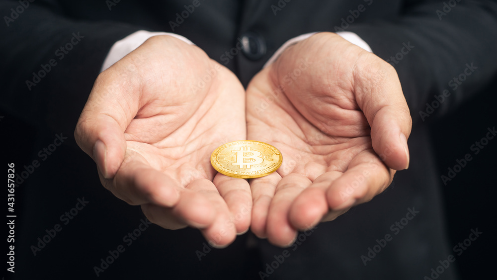 Selective focus cryptocurrency golden bitcoin coin on hand. Alternative finance and investment concept. Selective focus cryptocurrency golden bitcoin coin on hand. Alternative finance and investment concept.