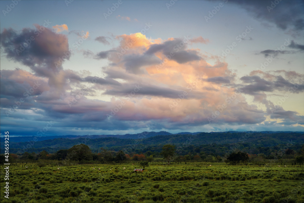 Fototapeta premium Sunset Clouds over Fields in Costa Rica