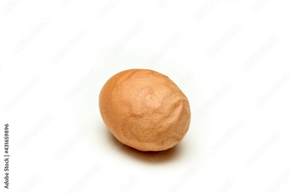 The organic egg with rough and wavy eggshell. Isolated on white background. Reason can be the old hen, insufficient nutrition or wrong process of formation of the egg. The organic egg with rough and wavy eggshell. Isolated on white background. Reason can be the old hen, insufficient nutrition or wrong process of formation of the egg.