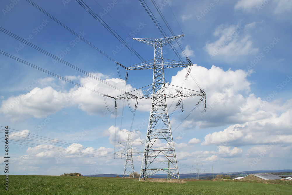 High voltage electric tower background of blue sky with clouds