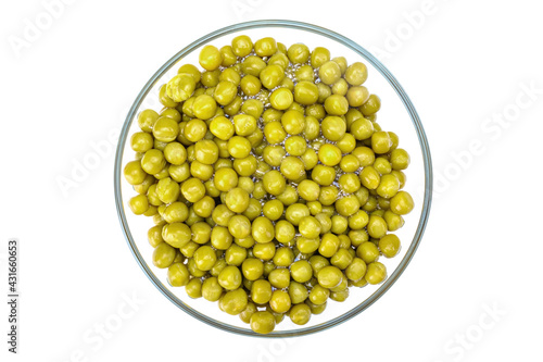 green canned peas in a glass bowl, isolated on a white background.Top view.