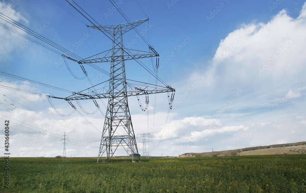 High voltage electric tower background of blue sky with clouds