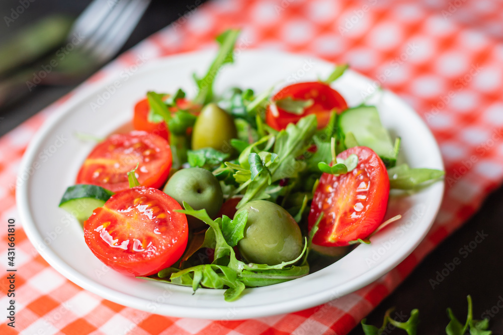 salad vegetable olives tomato cucumber, lettuce mix leaves snack meal diet vegan or vegetarian food copy space food background rustic. top view salad vegetable olives tomato cucumber, lettuce mix leaves snack meal diet vegan or vegetarian food copy space food background rustic. top view