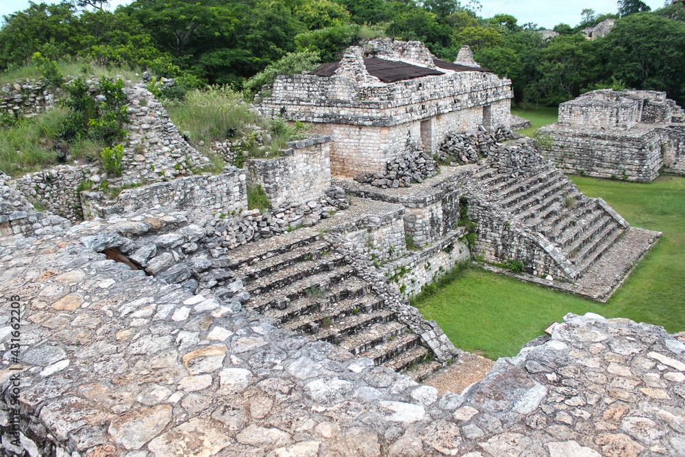 Ek Balam, Temozon, Yucatan, Mexico. Top view from the Oval palace building on jungles with the Twins temples atop of which there are two mirroring temples on either side. 
