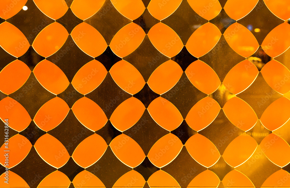 Orange decorative translucent glass with a diamond pattern. Orange decorative translucent glass with a diamond pattern.