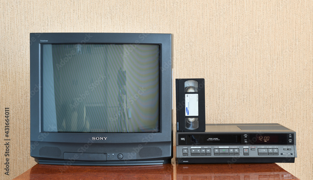Berlin, Germany 11.29.2020: Old black SONY TV and a vintage Philips VR6460  video recorder from the 1980s, 1990s, 2000s next to it. Videocassette  SAMSUNG. Photos | Adobe Stock