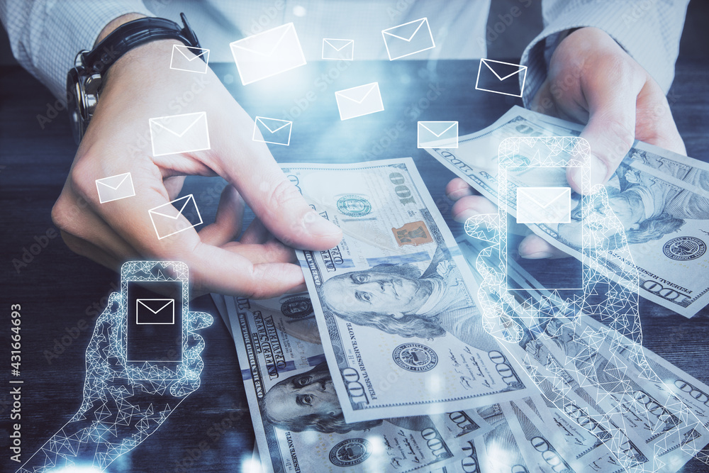Multi exposure of envelop drawing hologram and USA dollars bills and man hands. Technology concept. Multi exposure of envelop drawing hologram and USA dollars bills and man hands. Technology concept.