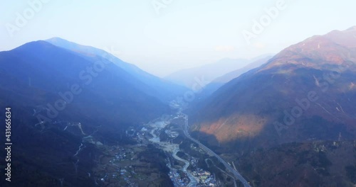 China`s rapid infrastructure development. Buidling highways across mountains and valleys photo