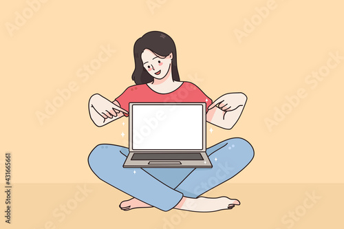 Copy space, screen, technology concept. Young smiling girl cartoon character sitting pointing with finger at laptop screen with blank white screen vector illustration 