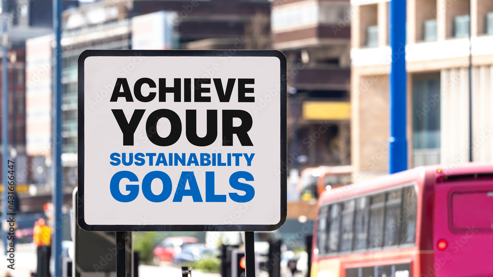Achieve Your Sustainability Goals sign in a busy city centre
