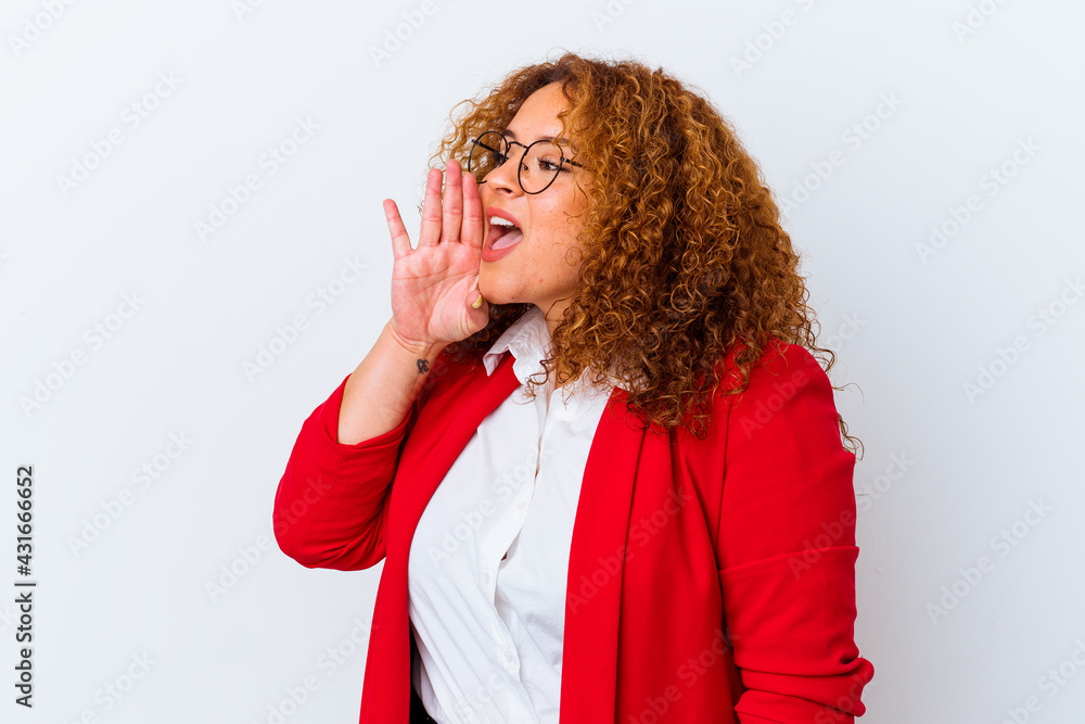 Young latin curvy woman isolated on white background shouting and holding palm near opened mouth. Young latin curvy woman isolated on white background shouting and holding palm near opened mouth.