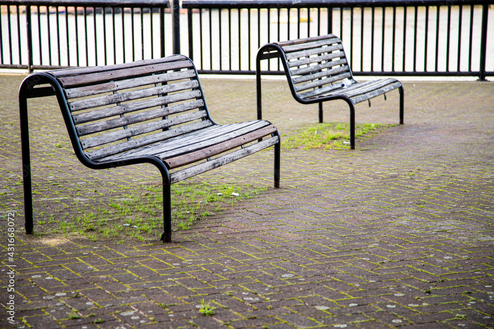 Empty Benches along the River Thames in London Empty Benches along the River Thames in London