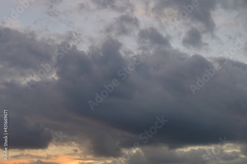 Abstract background of cloudy sunset sky golden hour.