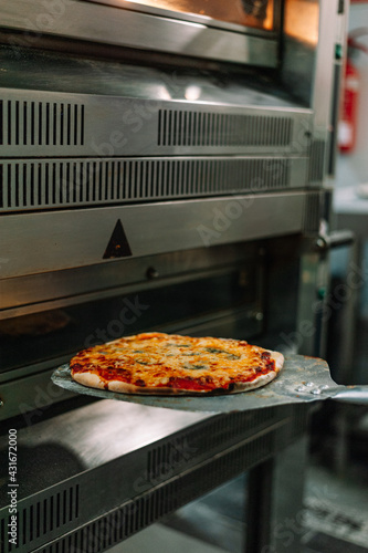 Pizza Into The Oven