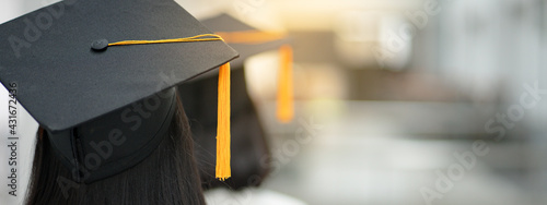 Fotografía Young happy Asian woman university graduate in graduation gown and cap in the college campus