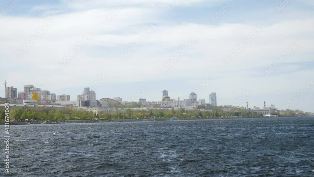 Samara city, Russia. May 2, 2021. View from Volga River on Samara square. Ships on waves. Sunny windy day. One of largest beautiful Russian cities. historical centre of town. 4 k video Samara city, Russia. May 2, 2021. View from Volga River on Samara square. Ships on waves. Sunny windy day. One of largest beautiful Russian cities. historical centre of town. 4 k video