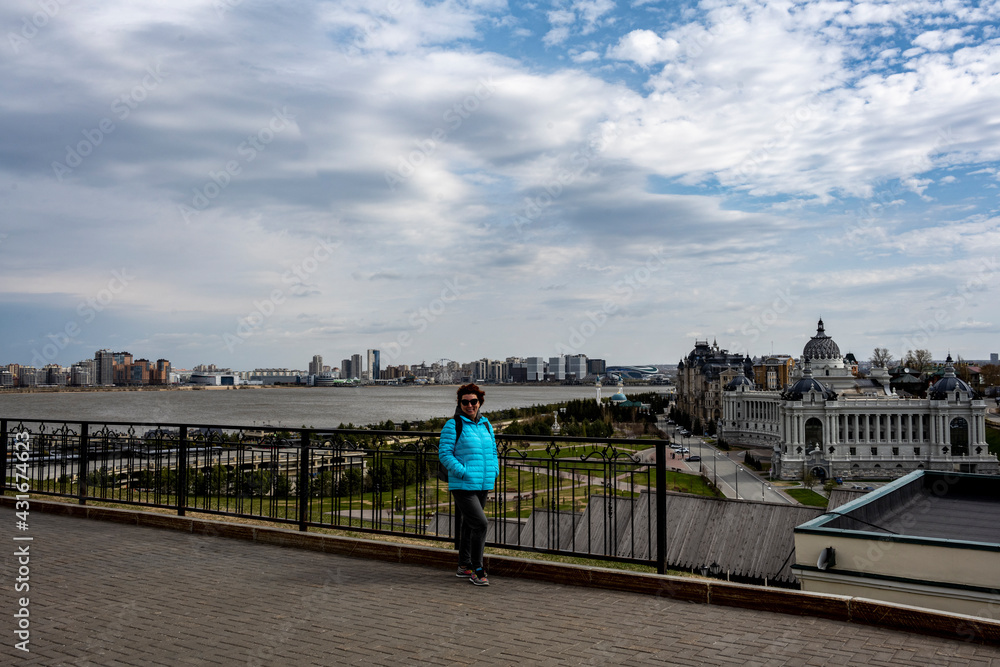 female tourist in a blue jacket visits the sights of the Kazan Kremlin 