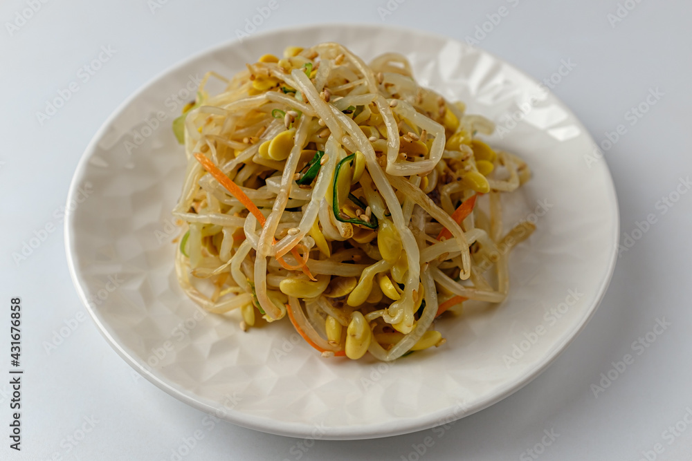 Tossed bean sprouts on a white background Tossed bean sprouts on a white background