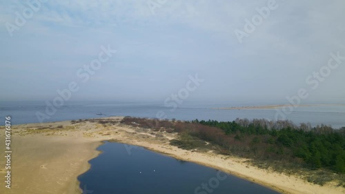 Wallpaper Mural  Aerial side shot of Mikoszewskie lake and Vistula River ended in sandbank of Mewia Lacha Nature Reserve during a sunny day, Baltic Sea in background. Torontodigital.ca
