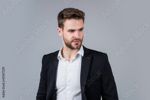 young handsome man in formal wear has bristle on face, agile business