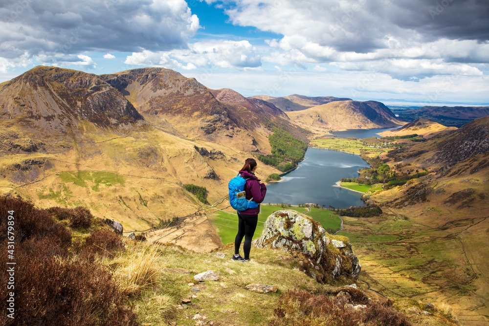 Woman on Fleetwith Pike looking north over Buttermere.  English Lake District.