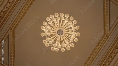 Antique crystal chandelier in a historic mansion, camera rotation