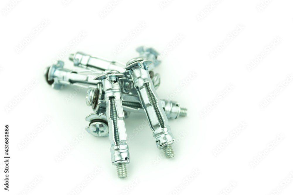 Metal anchor and screw on concrete on a white background Metal anchor and screw on concrete on a white background