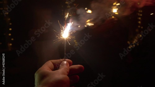 Bengal fire in hand at a party, dancing people
