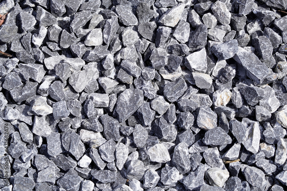 Grit as decorative stones in the garden. Background motif from gray stones. Gravel. Grit as decorative stones in the garden. Background motif from gray stones. Gravel.