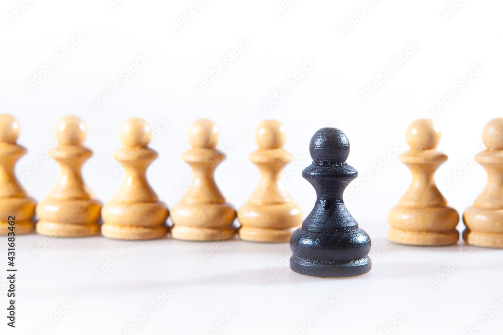 Black and white chess pieces on the white background Black and white chess pieces on the white background