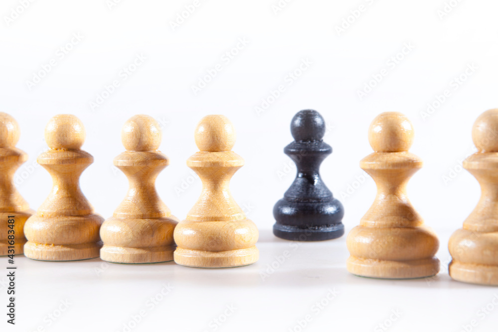 Black and white chess pieces on the white background Black and white chess pieces on the white background