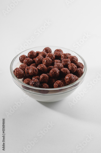 Healthy breakfast ingredients. Breakfast cereal, milk or yogurt glass, white background, copy space
